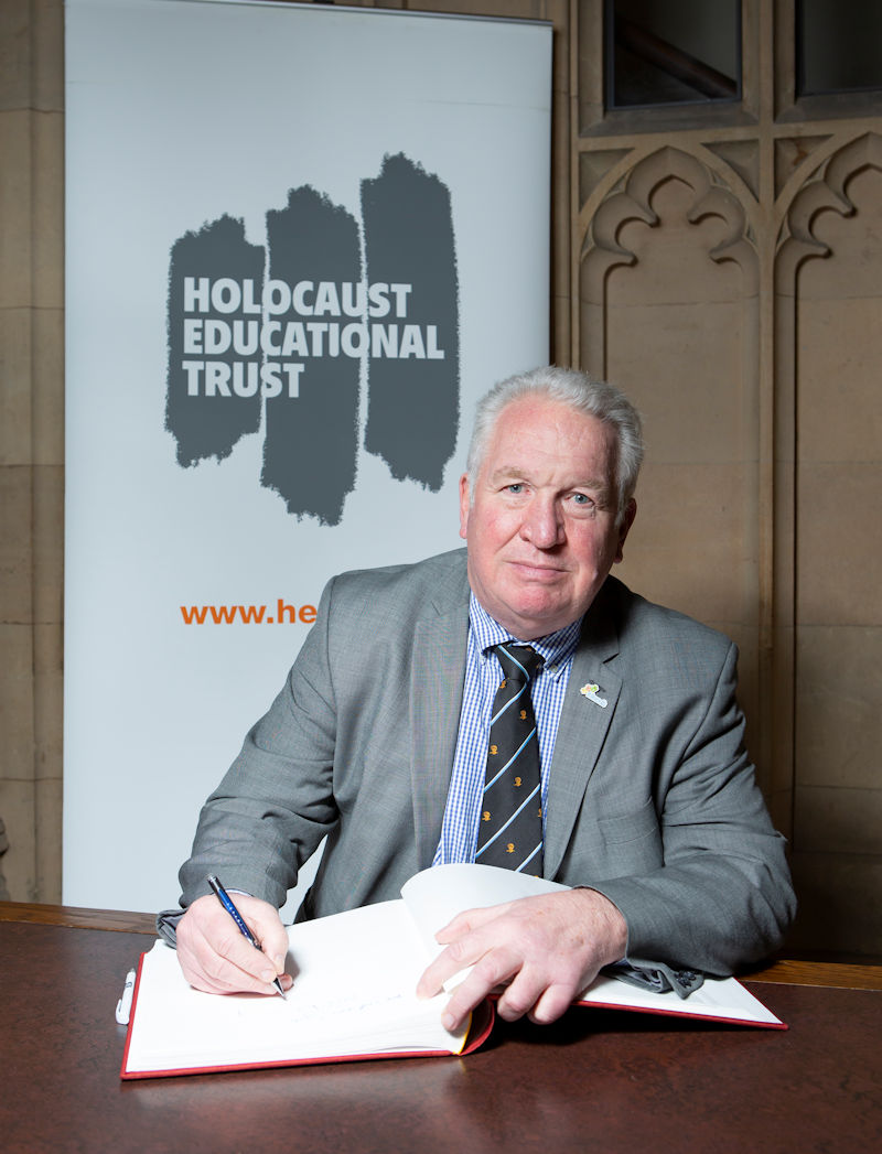 Sir Mike Penning MP signs the Holocaust Educational Trust’s Book of Commitment