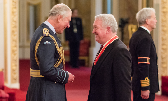 Sir Mike Penning MP attends his investiture at Buckingham Palace