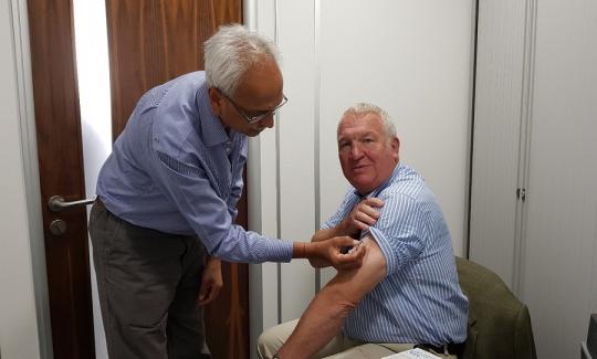 Sir Mike Penning gets his flu jab at Woods Pharmacy in Bellgate to promote the NHS flu vaccination campaign