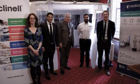 Sir Mike Penning and representatives of GAMA Healthcare with the Rediroom in Westminster